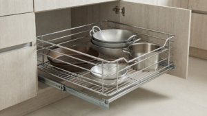 Pull-out wire basket organizer in base cabinet.