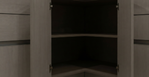 An empty, dark L-shaped blind corner kitchen cabinet showing fixed wooden shelves and deep, unreachable space.