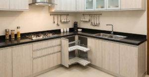 Close-up of a high-quality stainless steel modular kitchen drawer organizer showing dividers for cutlery and tools.